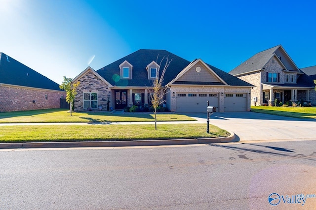 view of front of house featuring a front lawn and a garage