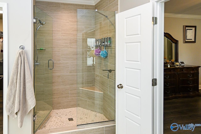 bathroom featuring walk in shower and ornamental molding