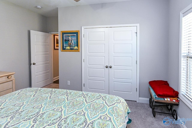 bedroom featuring a closet and carpet