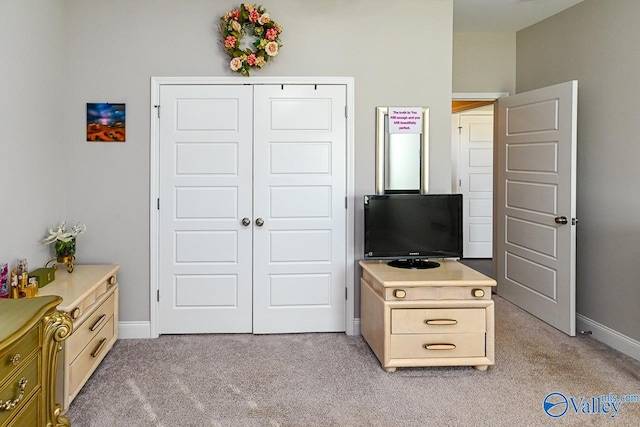 carpeted bedroom with a closet