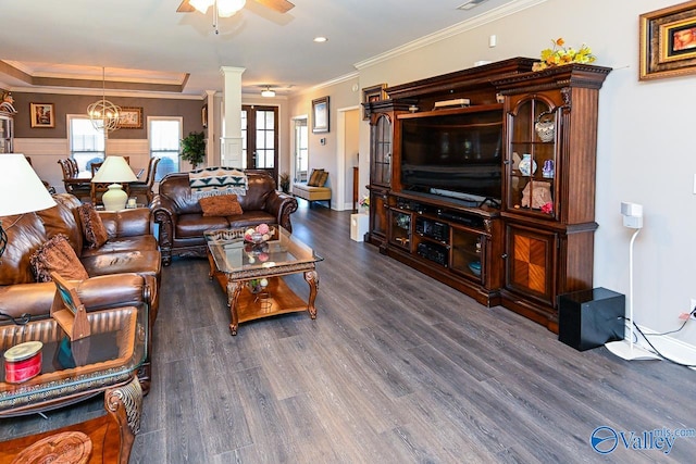 living room with dark wood-type flooring, ceiling fan, ornamental molding, and ornate columns