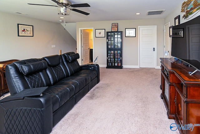 living room with light carpet and ceiling fan