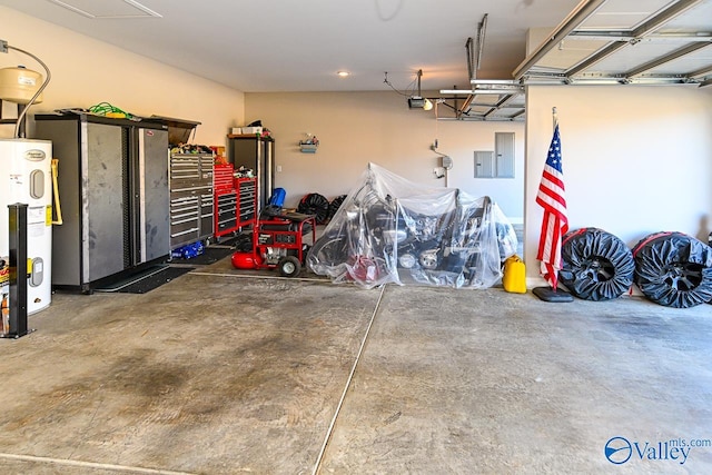 garage featuring a garage door opener and water heater