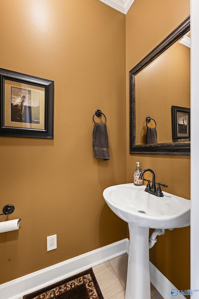 bathroom with tile patterned flooring and baseboards