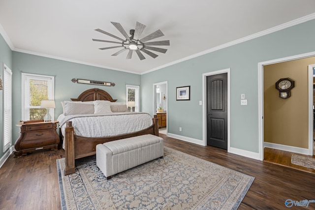 bedroom with ensuite bath, crown molding, baseboards, and dark wood-style flooring