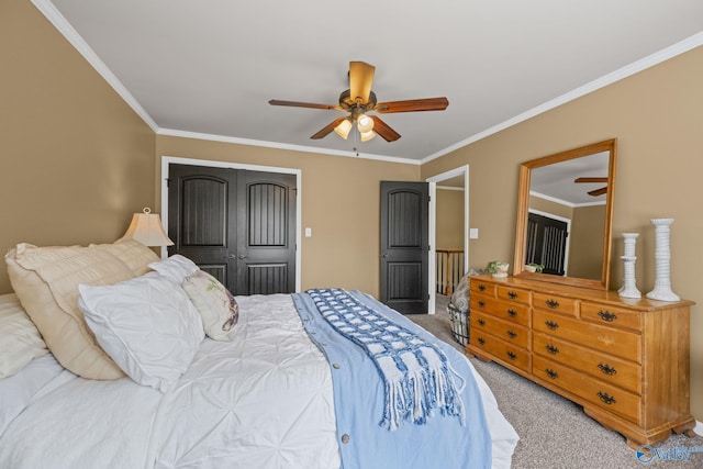 carpeted bedroom with a closet, a ceiling fan, and ornamental molding