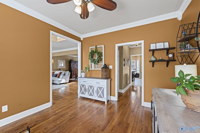 interior space with baseboards, dark wood finished floors, and ornamental molding