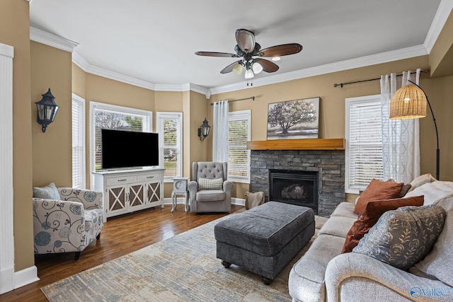 living room with crown molding and wood finished floors