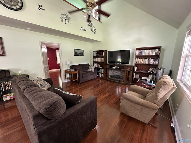 living area featuring high vaulted ceiling, a ceiling fan, a healthy amount of sunlight, and wood finished floors