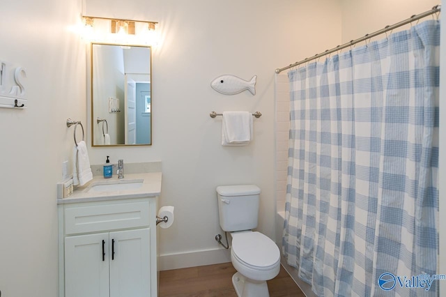 full bathroom with a shower with curtain, toilet, baseboards, wood finished floors, and vanity