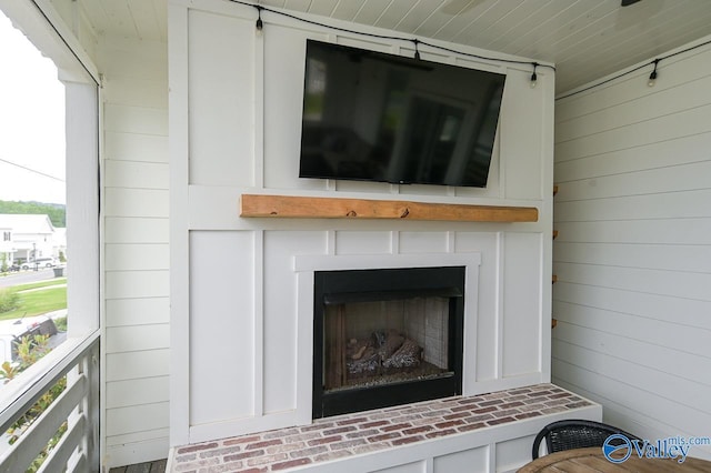 details with a fireplace with raised hearth