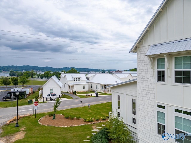 exterior space with a mountain view and a residential view