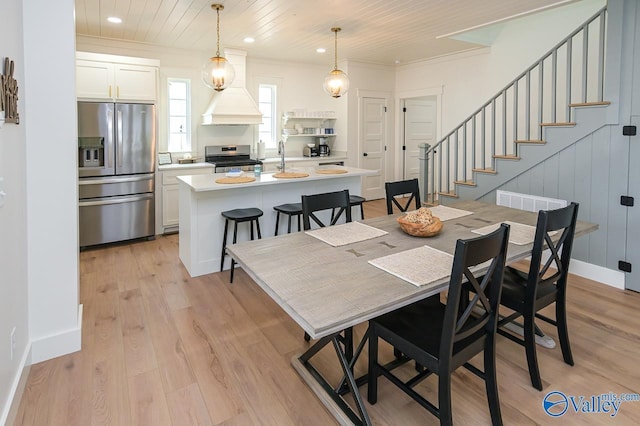 dining area with recessed lighting, stairway, light wood-type flooring, crown molding, and wood ceiling