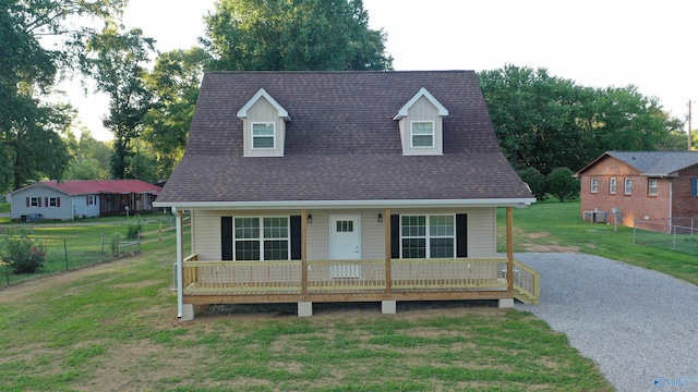 view of front facade with a front lawn and a porch