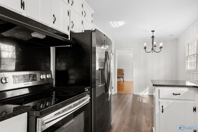 kitchen featuring pendant lighting, dark wood finished floors, stainless steel electric stove, white cabinetry, and dark stone counters