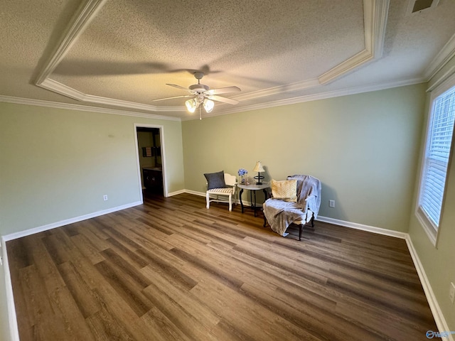 sitting room featuring a textured ceiling, wood finished floors, and crown molding