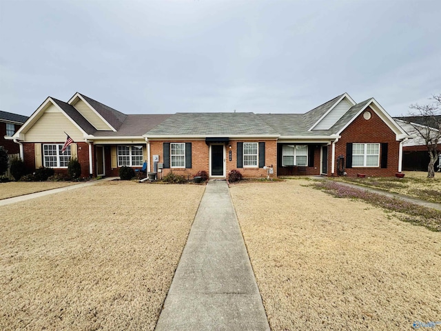 single story home with brick siding