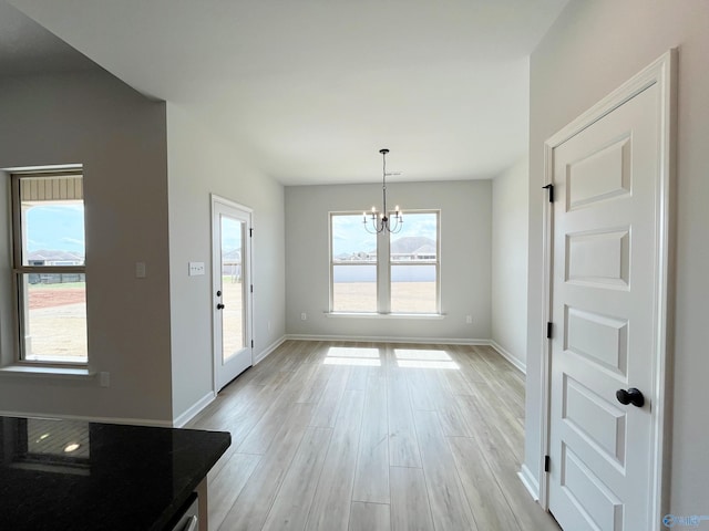 120 Parvin Way Dr, Hazel Green, AL 35750 - unfurnished dining area featuring baseboards, light wood-style floors, and a chandelier
