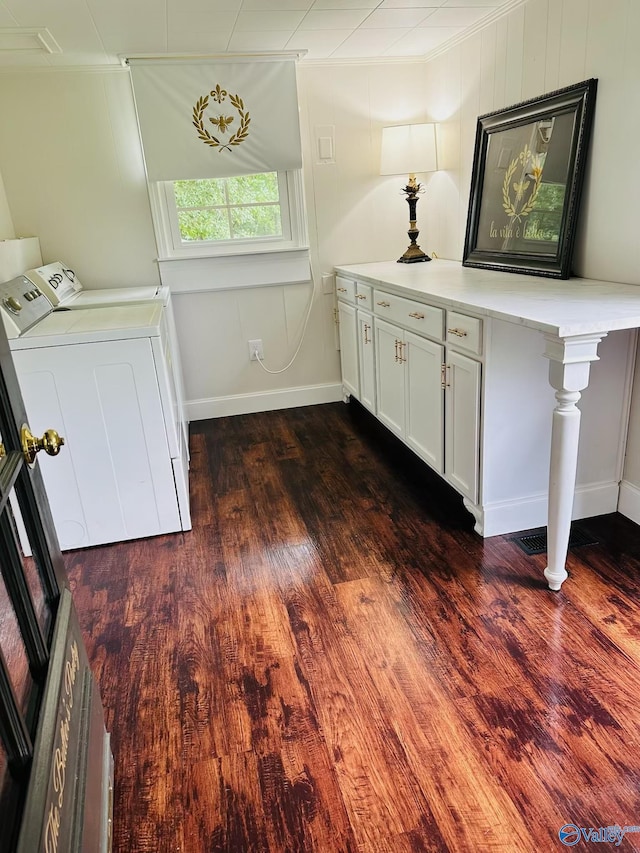 2010 Youngs Chapel Rd, Piedmont, AL 36272 - interior space with washer / dryer, dark wood-type flooring, ornamental molding, and baseboards