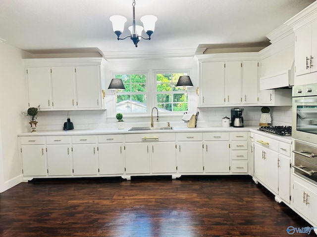 2010 Youngs Chapel Rd, Piedmont, AL 36272 - kitchen featuring a sink, light countertops, a chandelier, stainless steel appliances, and backsplash
