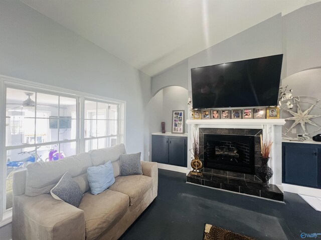 450 County Road 803, Centre, AL 35960 - living area with vaulted ceiling, arched walkways, and a tile fireplace