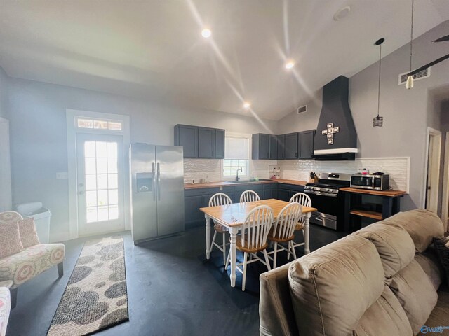 450 County Road 803, Centre, AL 35960 - kitchen featuring range hood, finished concrete floors, decorative backsplash, a sink, and stainless steel appliances