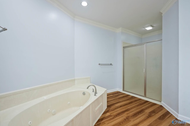 full bathroom with crown molding, a shower stall, a whirlpool tub, and wood finished floors