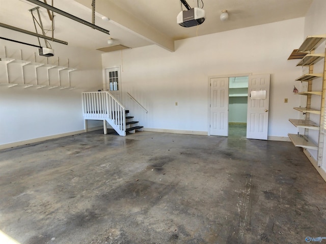 garage with a garage door opener and baseboards