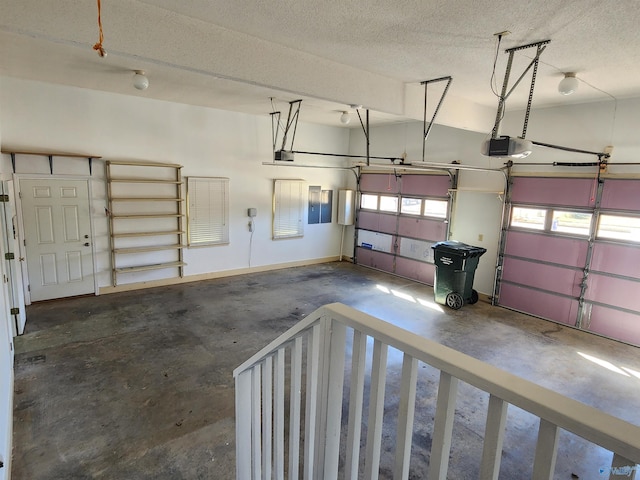 garage with electric panel, baseboards, and a garage door opener