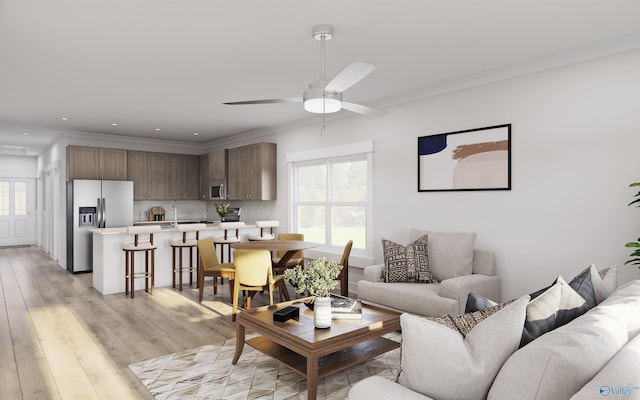 living room featuring crown molding, sink, ceiling fan, and light hardwood / wood-style floors