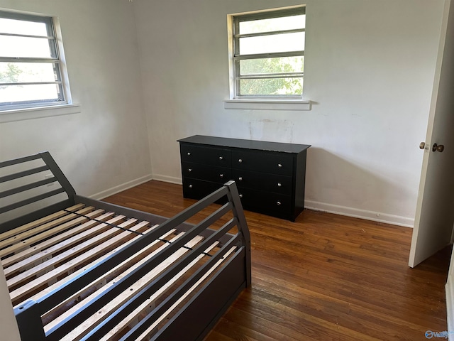 unfurnished bedroom featuring dark hardwood / wood-style flooring