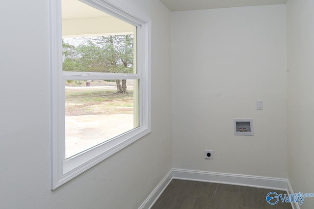 clothes washing area with electric dryer hookup, washer hookup, and dark hardwood / wood-style flooring