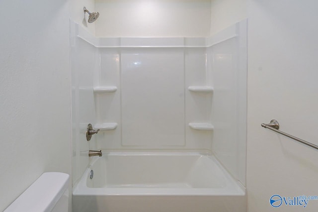 bathroom with toilet and  shower combination