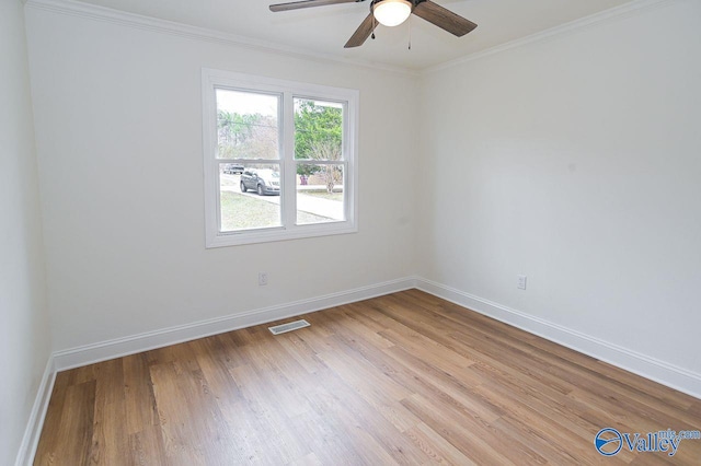 unfurnished room featuring crown molding, light wood-type flooring, and ceiling fan