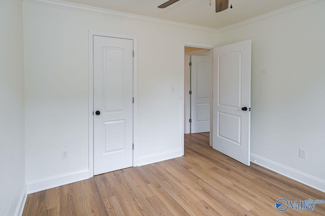 unfurnished bedroom with crown molding, light hardwood / wood-style flooring, and ceiling fan