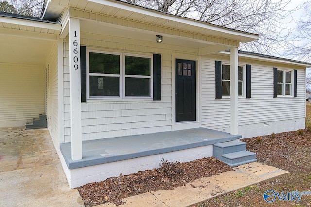 view of exterior entry with covered porch