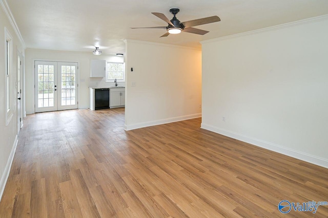 unfurnished living room with sink, french doors, ceiling fan, ornamental molding, and light hardwood / wood-style flooring