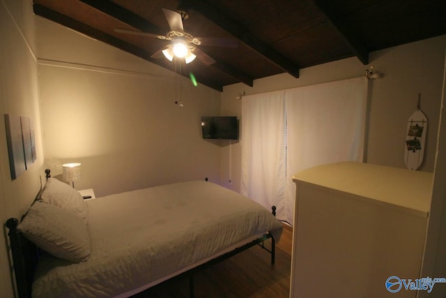 bedroom featuring lofted ceiling with beams, ceiling fan, and wood finished floors