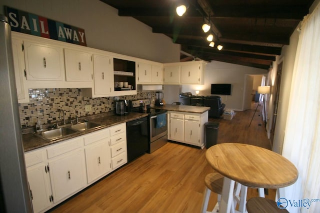 kitchen featuring black dishwasher, white cabinets, dark countertops, a sink, and stainless steel range with electric stovetop