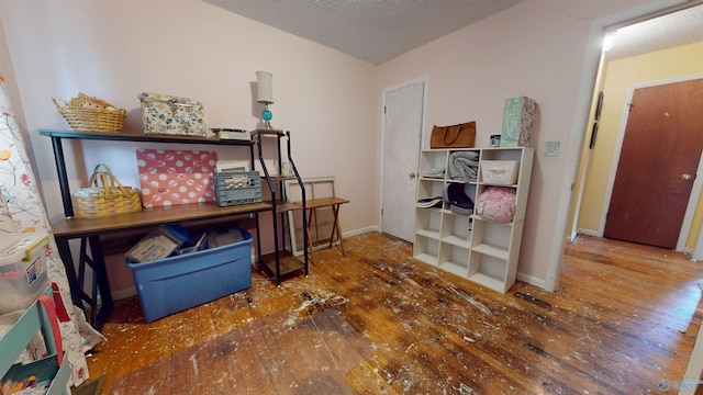 1303 7th Ave, Athens, AL 35611 - office area with wood-type flooring, baseboards, and a textured ceiling