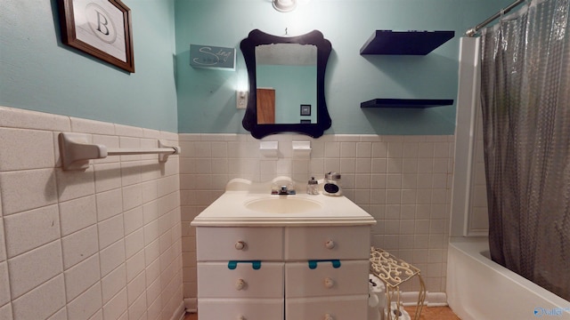 1303 7th Ave, Athens, AL 35611 - full bathroom featuring tile walls, vanity, wainscoting, shower / tub combo with curtain, and tile patterned floors