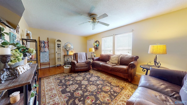 1303 7th Ave, Athens, AL 35611 - living room featuring ceiling fan, wood finished floors, a textured ceiling, and baseboards