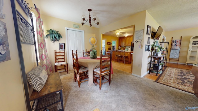 1303 7th Ave, Athens, AL 35611 - dining room featuring a chandelier, light colored carpet, and ceiling fan