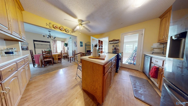 1303 7th Ave, Athens, AL 35611 - kitchen with refrigerator with ice dispenser, a textured ceiling, light countertops, and healthy amount of natural light