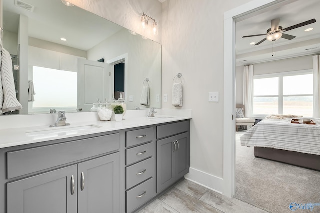 bathroom featuring ceiling fan and vanity