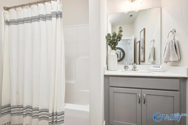 bathroom with vanity and shower / bathtub combination with curtain