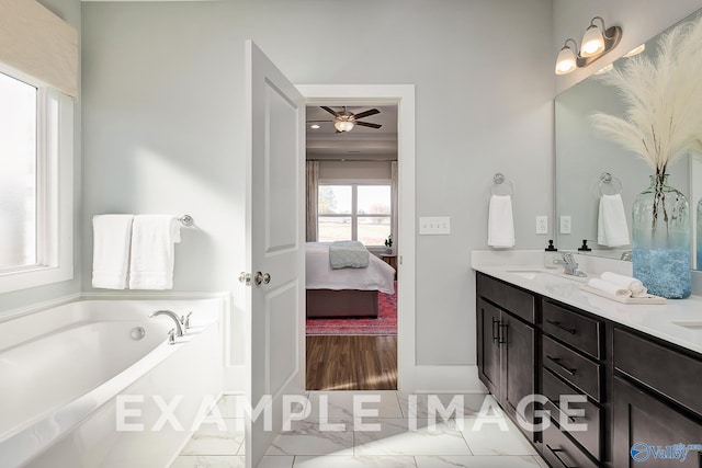 bathroom featuring vanity, ceiling fan, and a bath