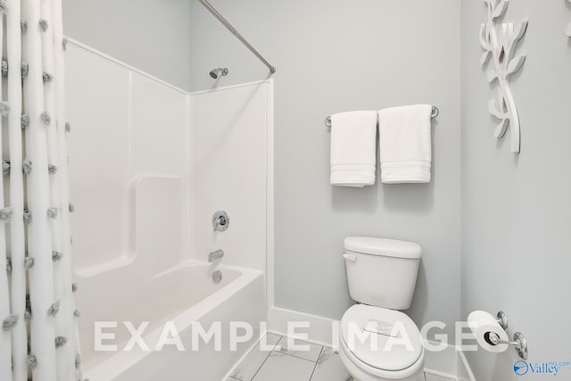 bathroom featuring shower / tub combo with curtain, toilet, and tile patterned flooring