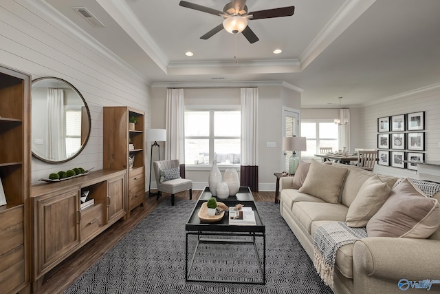 living room with ceiling fan, dark hardwood / wood-style floors, and a wealth of natural light