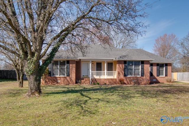 ranch-style home with brick siding, roof with shingles, crawl space, fence, and a front lawn